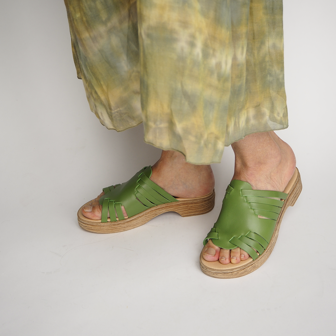 Andrea green leather clog sandal on model Calou