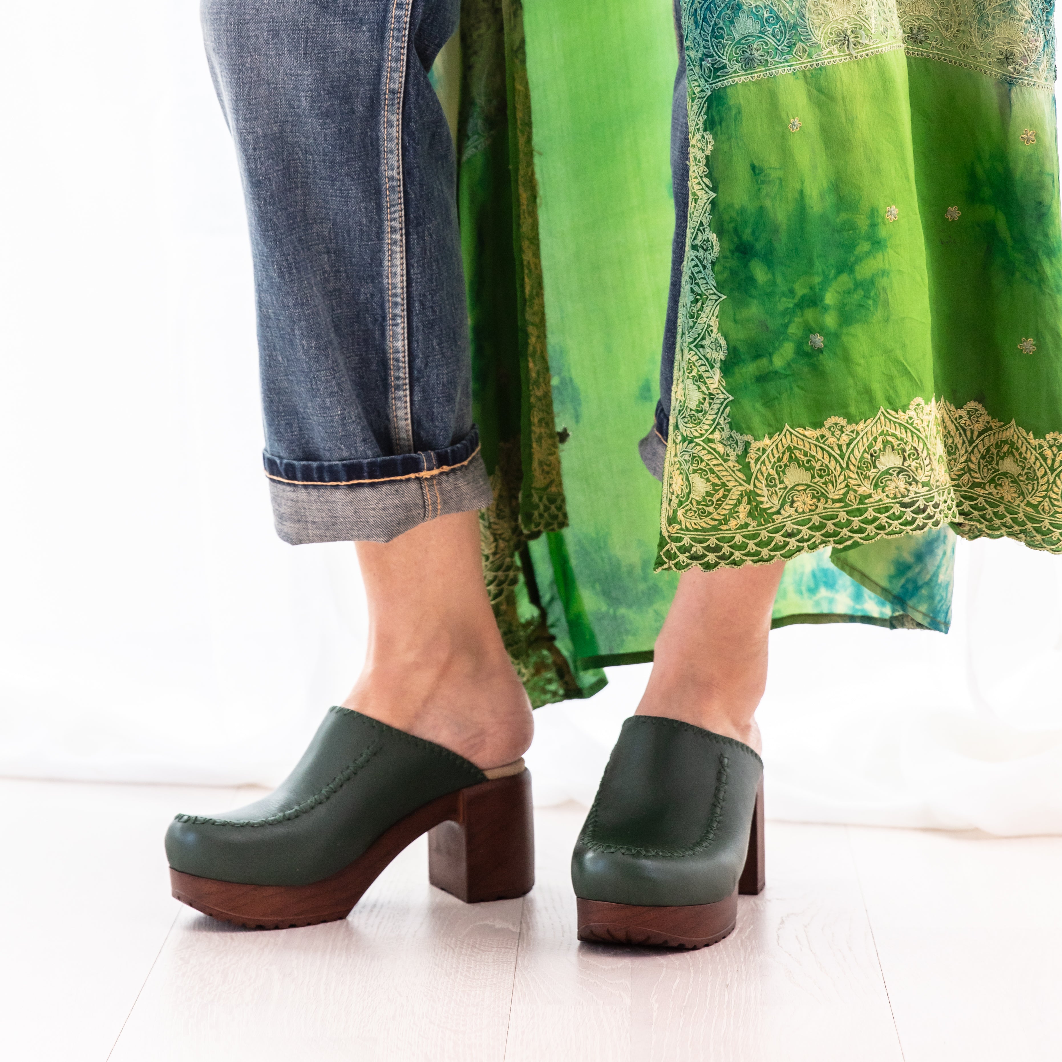 Blenda green leather clogs on model Calou Stockholm