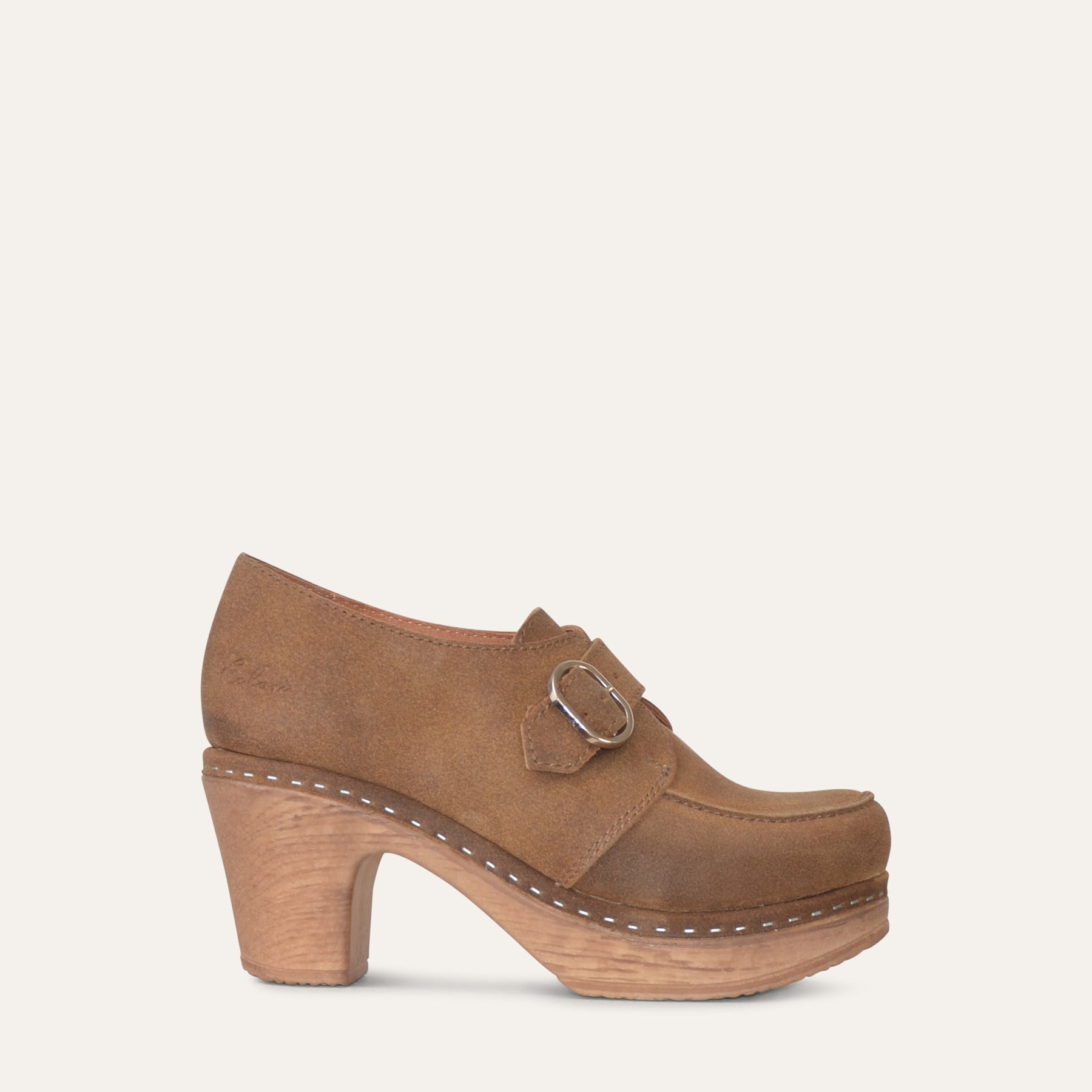 Camel (beige) suede wood-like clog shoe on a light beige background