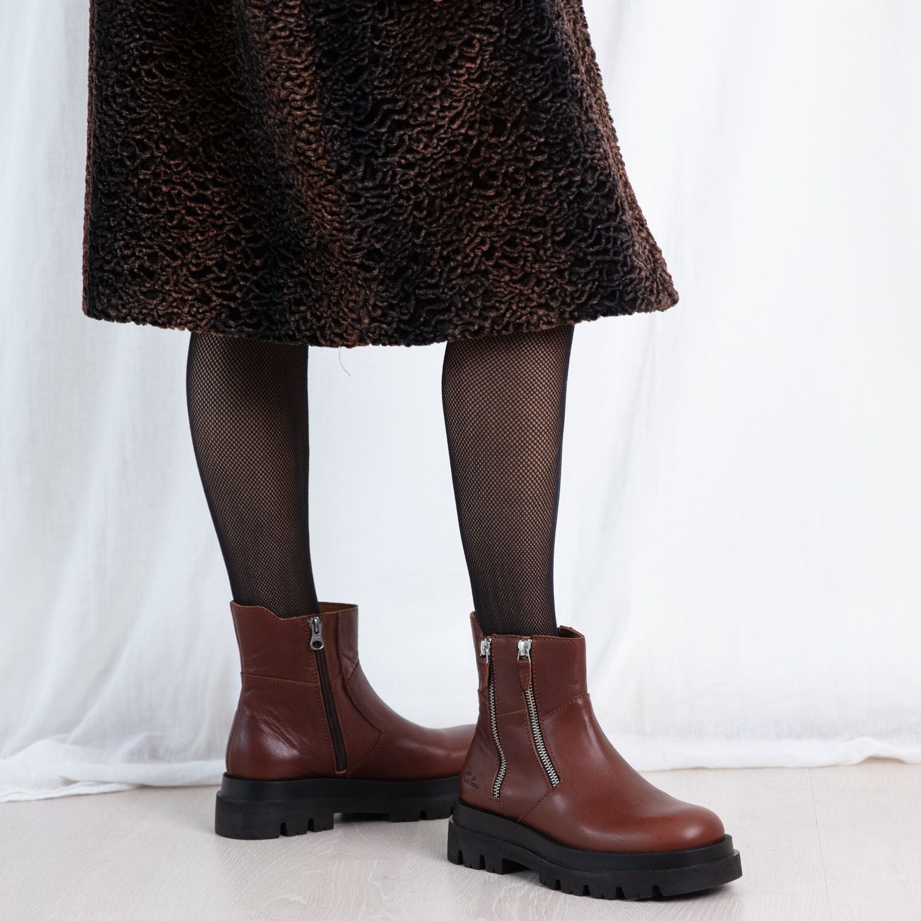 Emma brown leather tractor base boots on model Calou