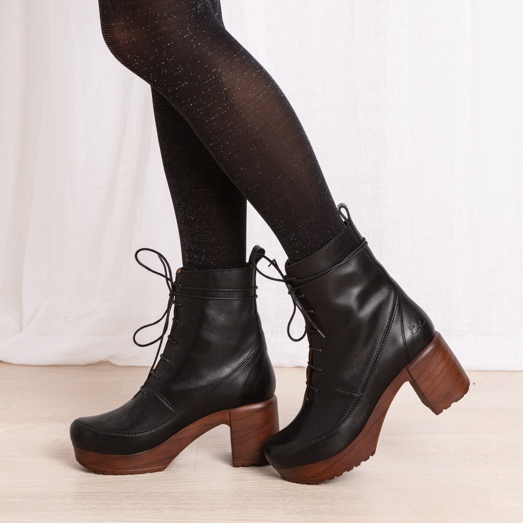 Greta black leather clog boot on model Calou