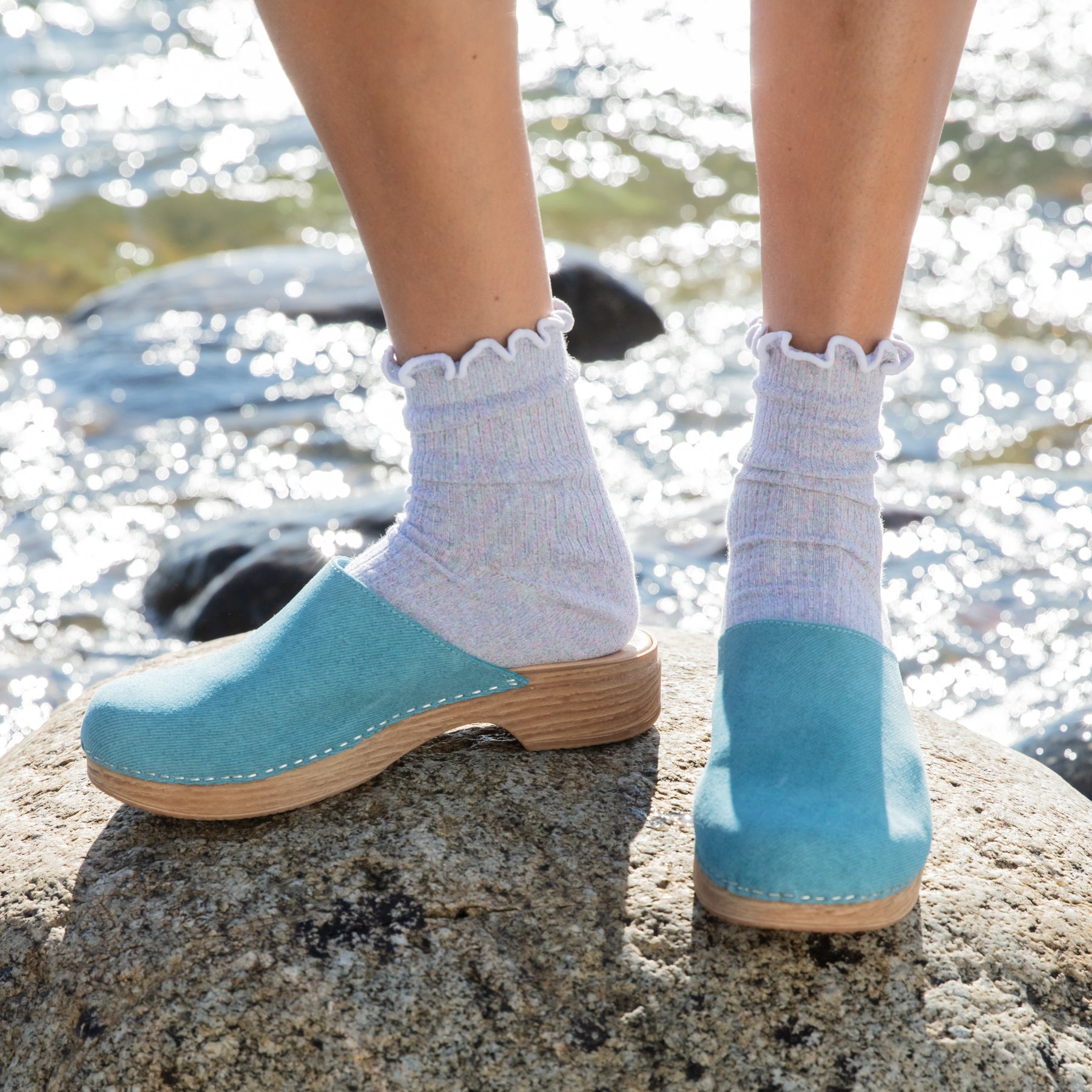 Helena turquoise suede clogs on model Calou Stockholm
