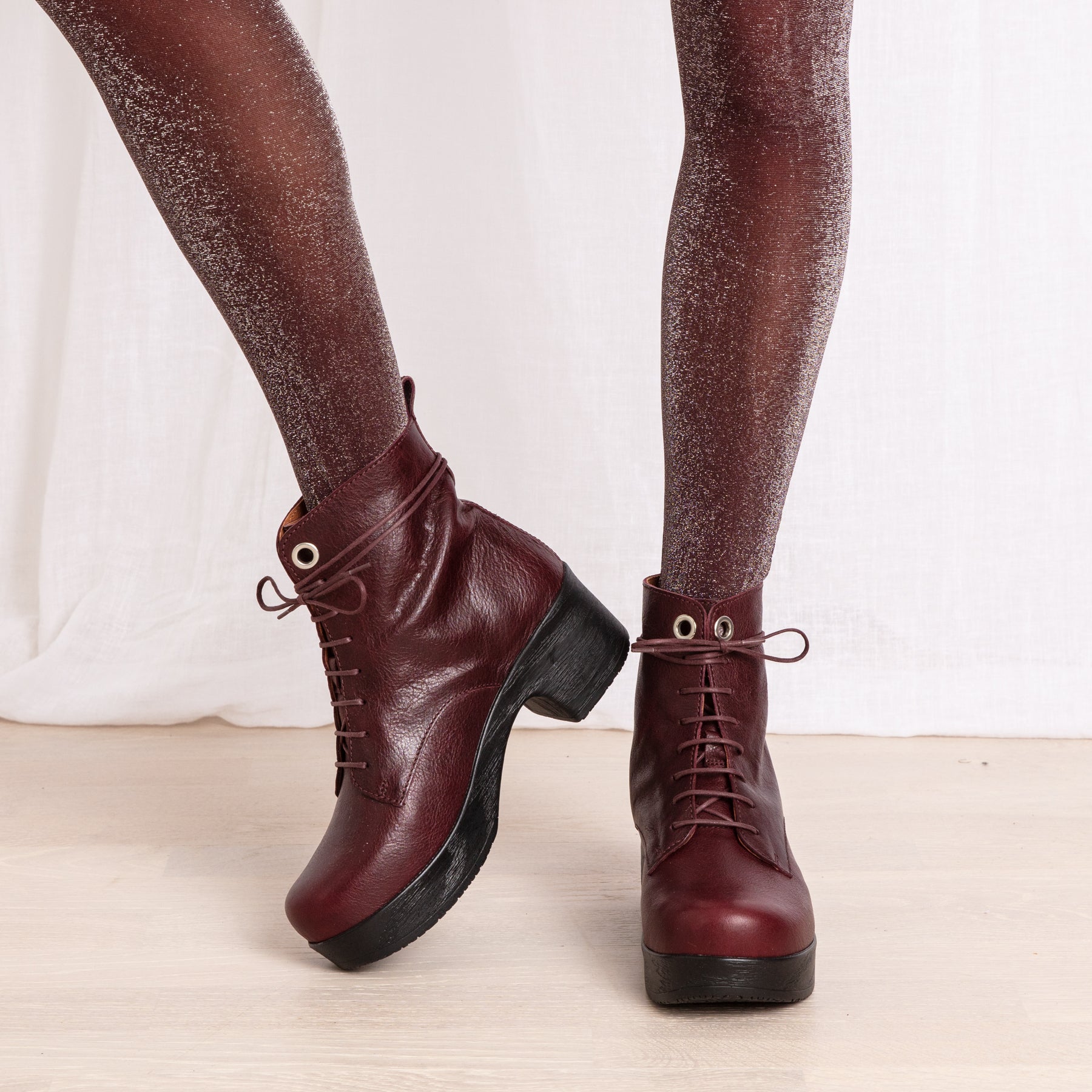 Jonna plum leather clog boots on model Calou