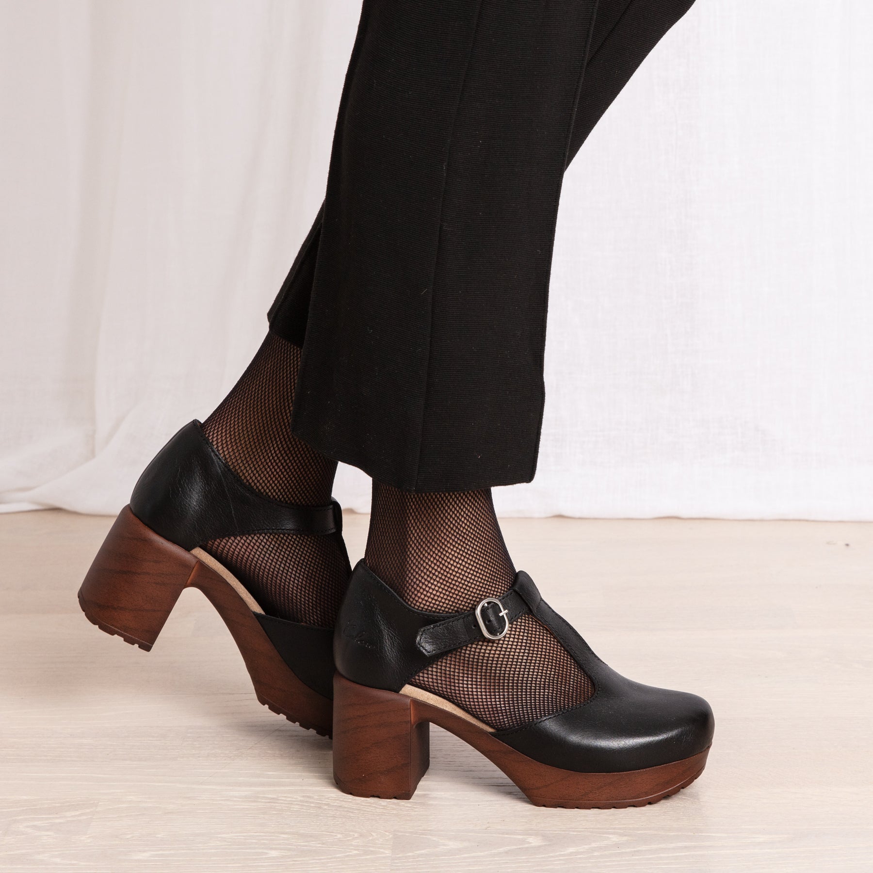 Kerstin black leather t-strap clog shoe on model Calou