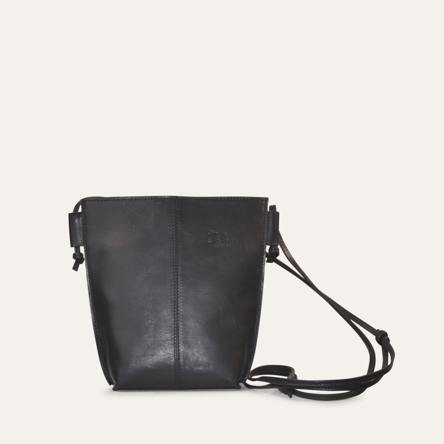 A small, sleek black leather shoulder bag with an adjustable shoulder strap.