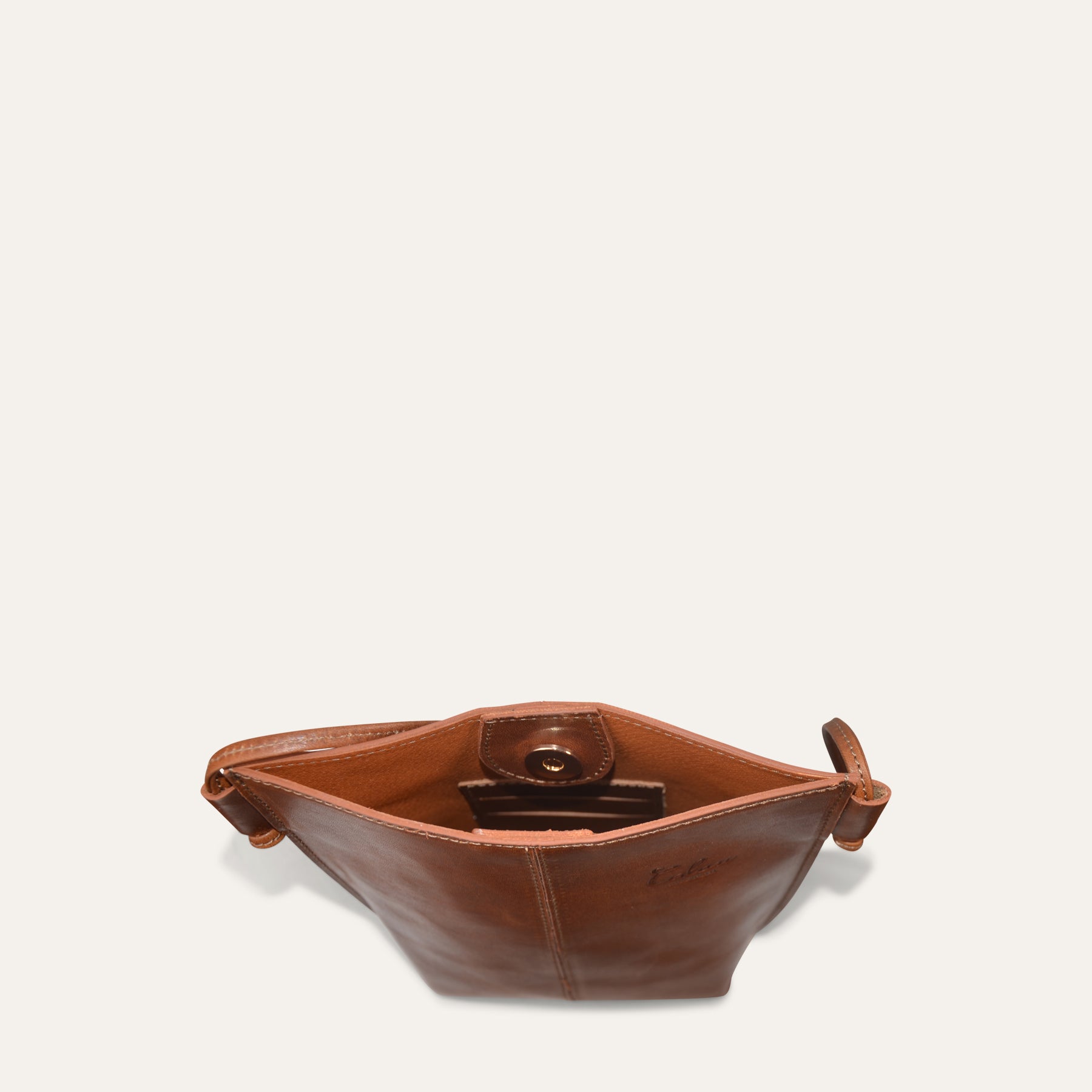 Brown leather pouch with a card holder on a white background