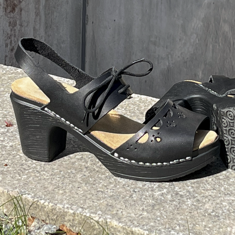 Notty black leather clog sandals on stone, Calou stockholm