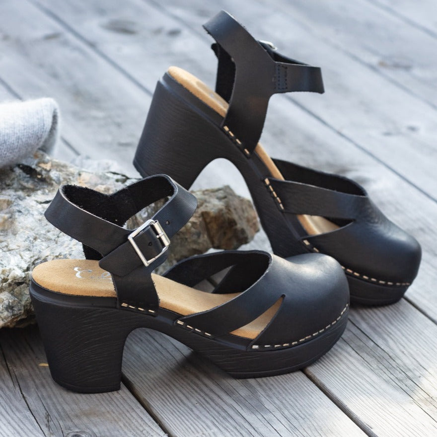 Penny black Mary jane clogs on pier Calou Stockholm