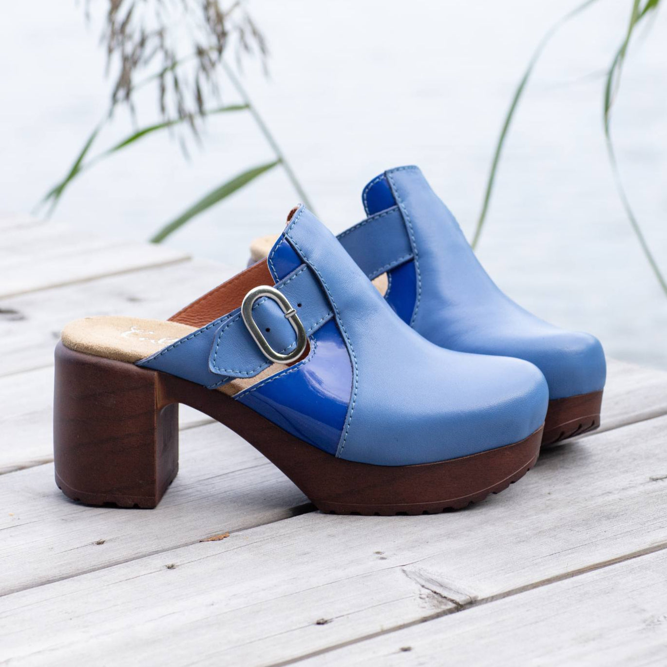Sonja blue leather clogs on pier, Calou Stockholm
