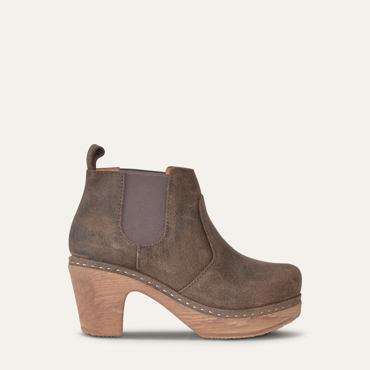 Oiled brown suede Calou Doris Chelsea clog boot with elastic side panels and 7.5 cm wooden-look heel, side view