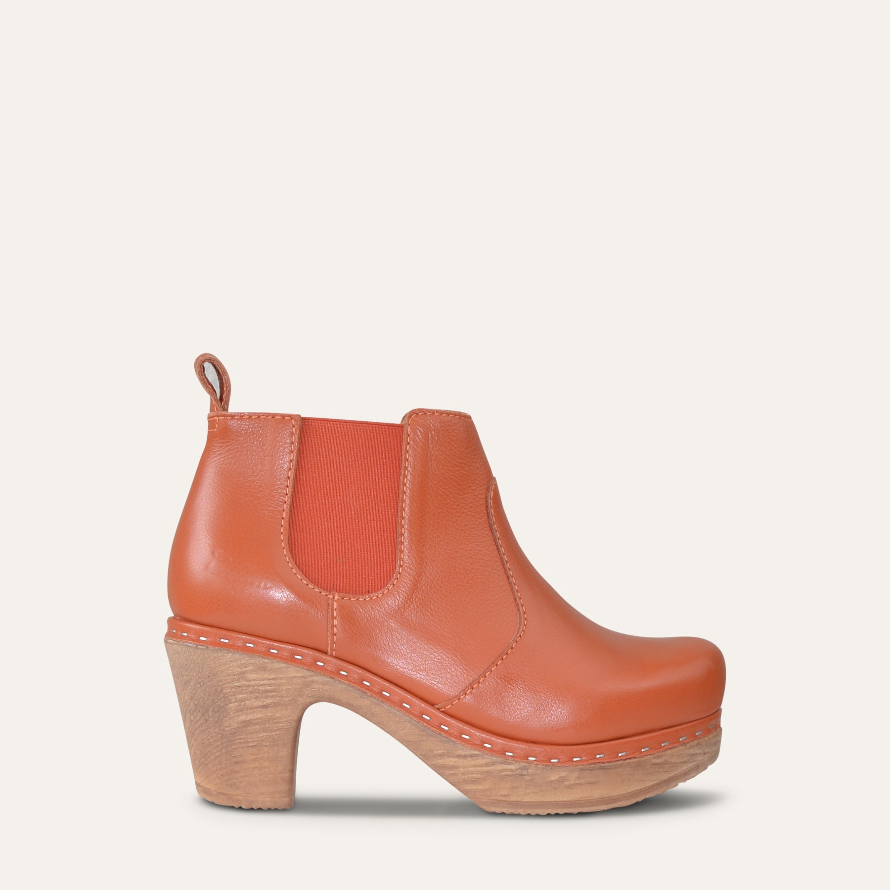 Rust leather Calou Doris Chelsea clog boot with elastic side panels and 7.5 cm wooden-look heel, side view