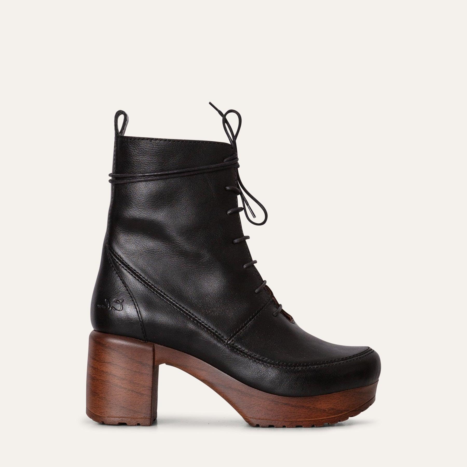 Greta Black leather clog boot with a lace-up design, wood-look heel, and Calou’s soft, flexible, cushioned sole.