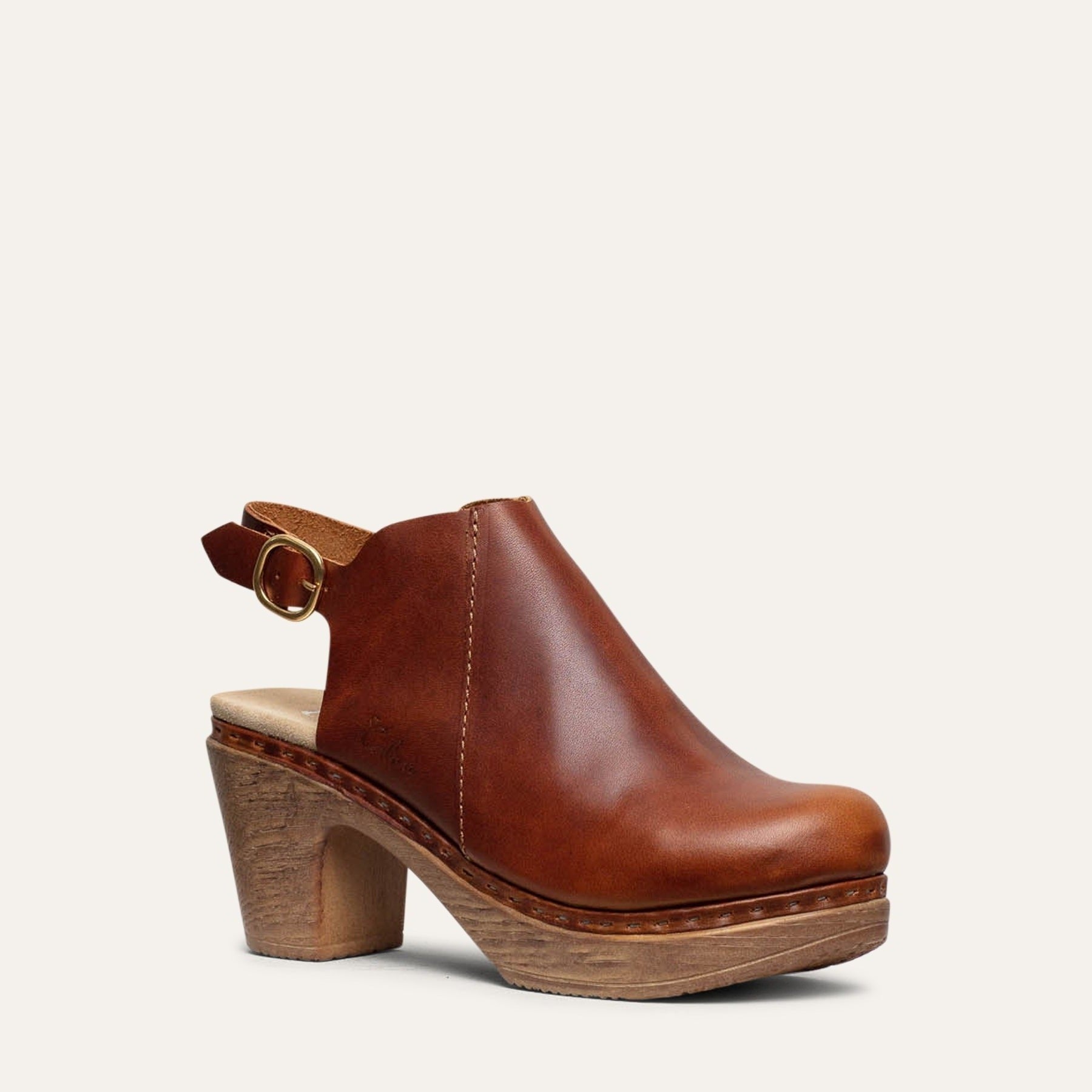 Calou Tyra Brown leather clog with a high heel, open back, and Calou’s soft, flexible, cushioned sole.