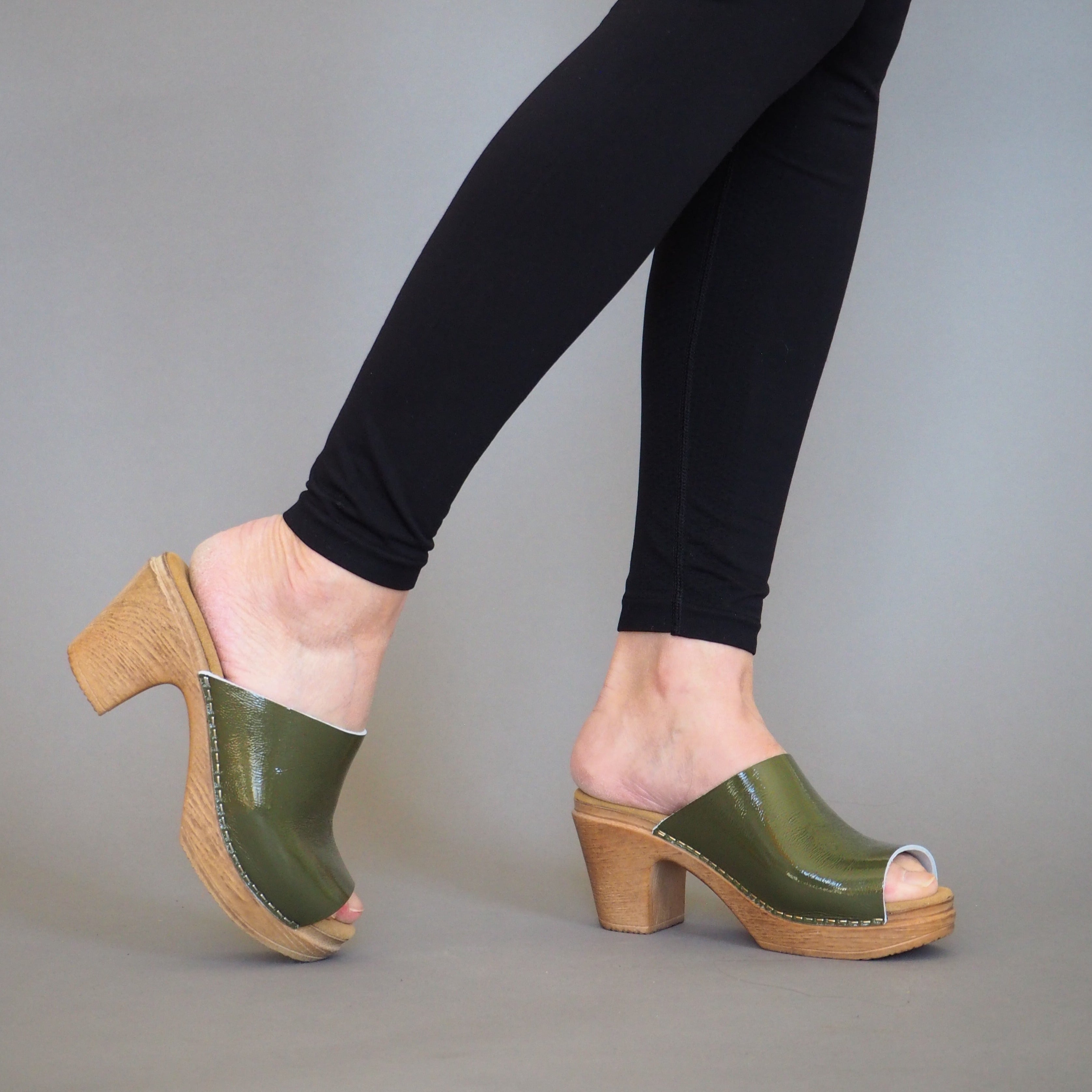 Frida green patent leather clog sandal on model calou stockholm