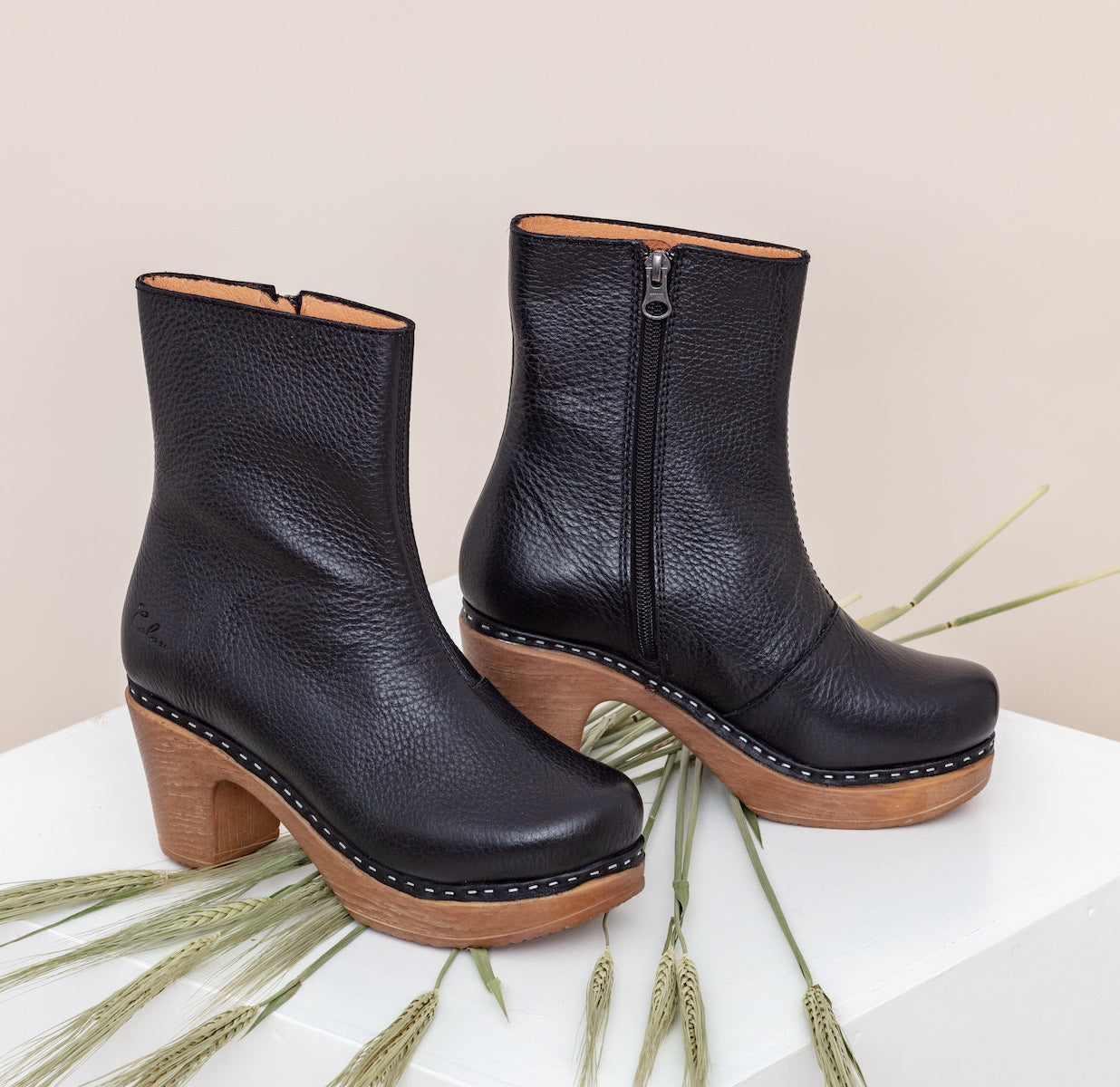 Molly black leather clog boot on table Calou