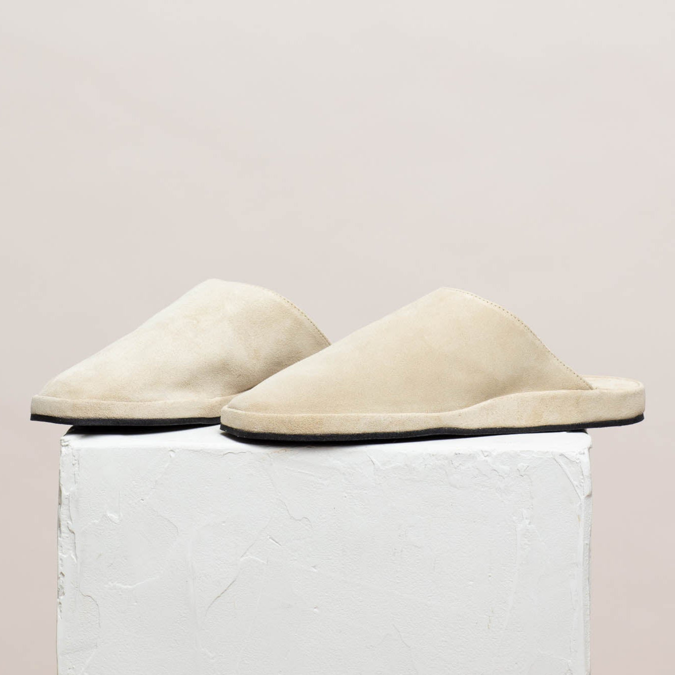 Tara off white suede slippers on pillar, Calou Stockholm