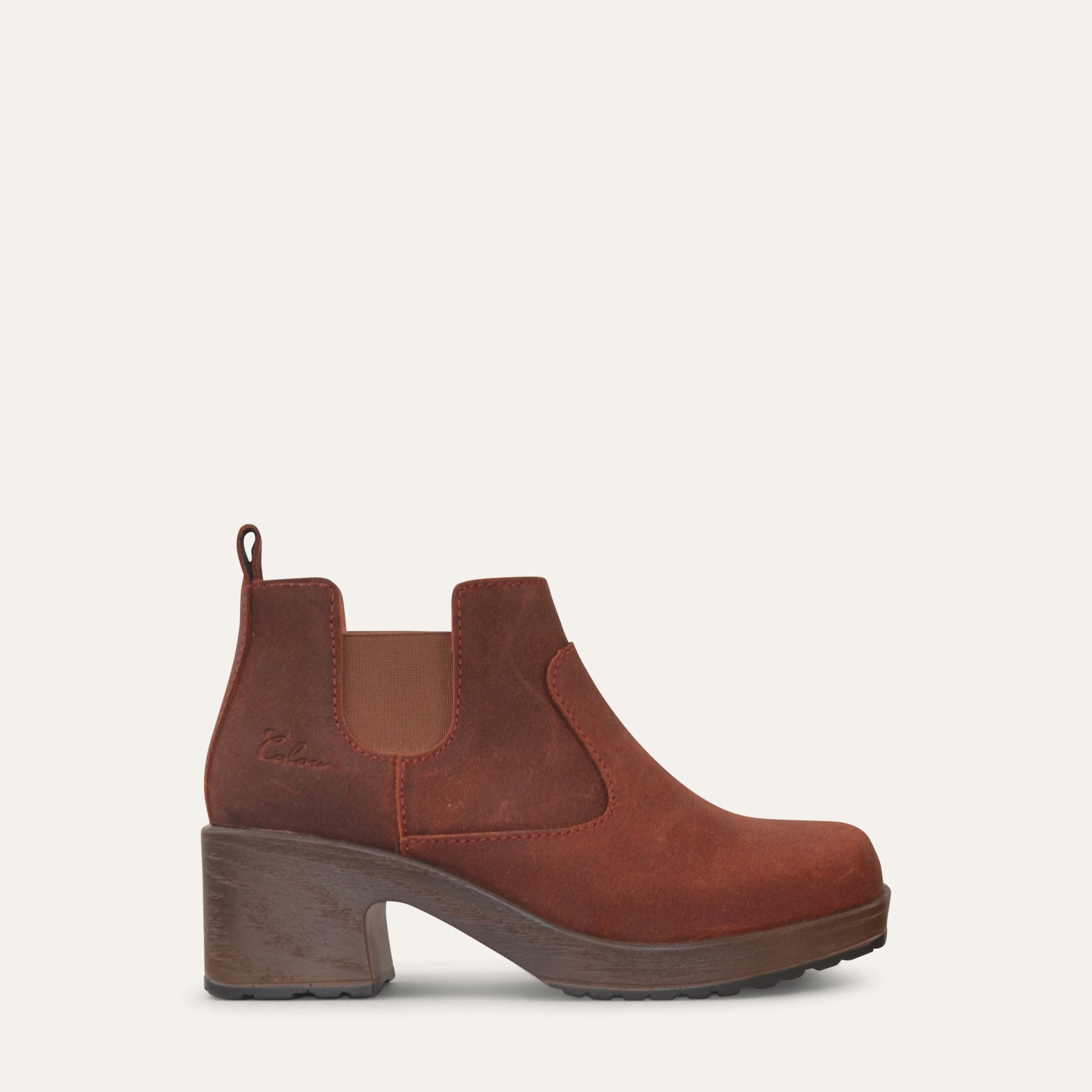 Rust Brown ankle boot with wooden sole on a light gray background