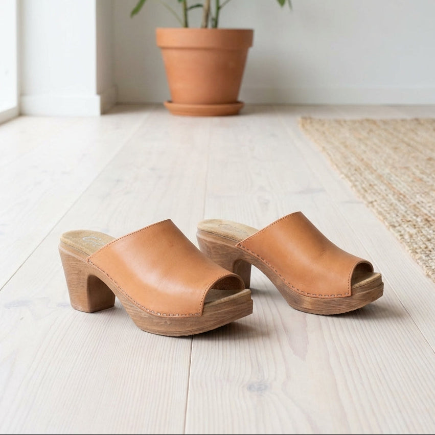 Lifestyle Pair of natural leather clogs with wood-look soles by Calou
