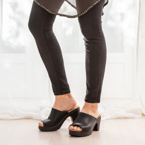 Frida black leather clog sandal on model