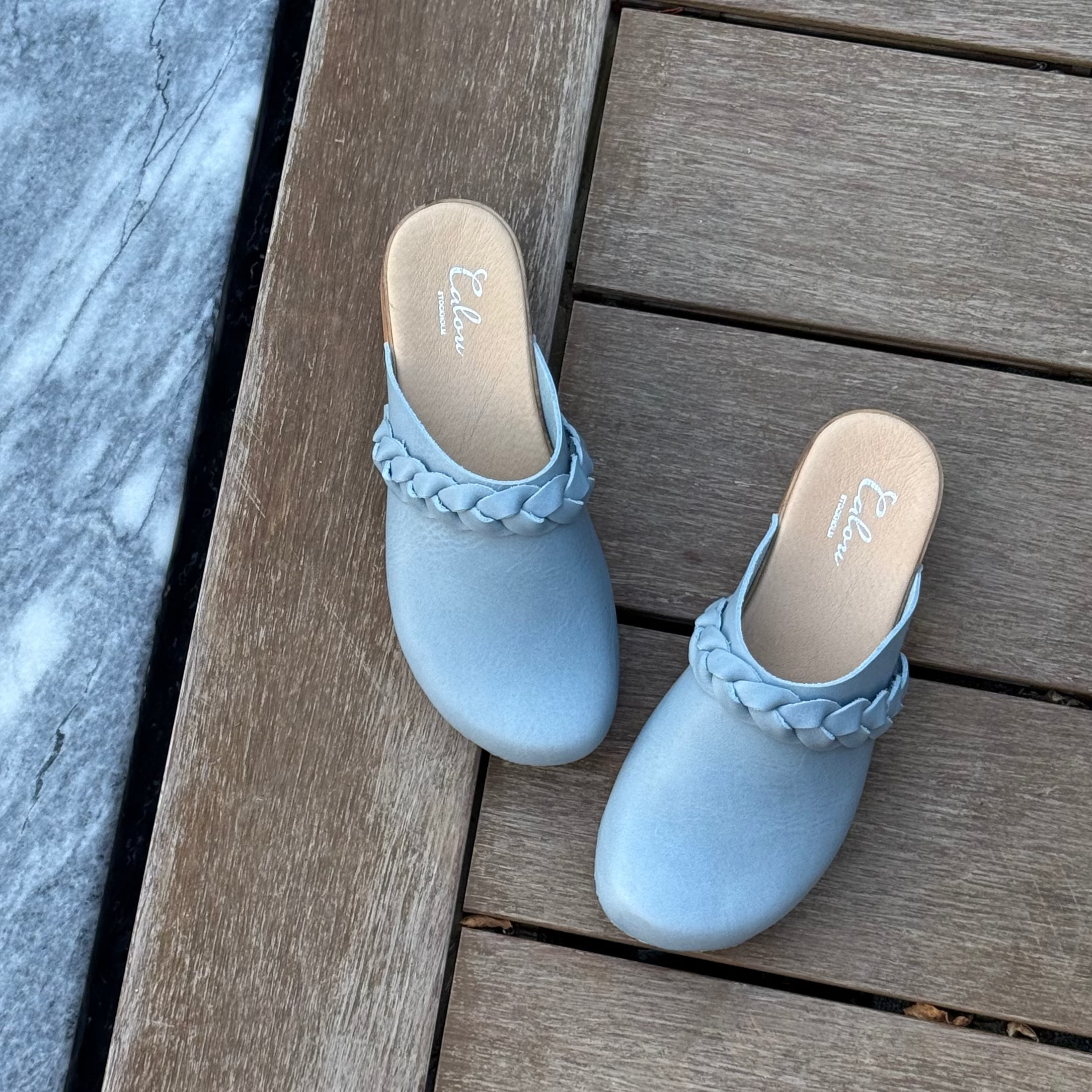 Helena blue leather clogs with braided detail along opening, soft flexible soles