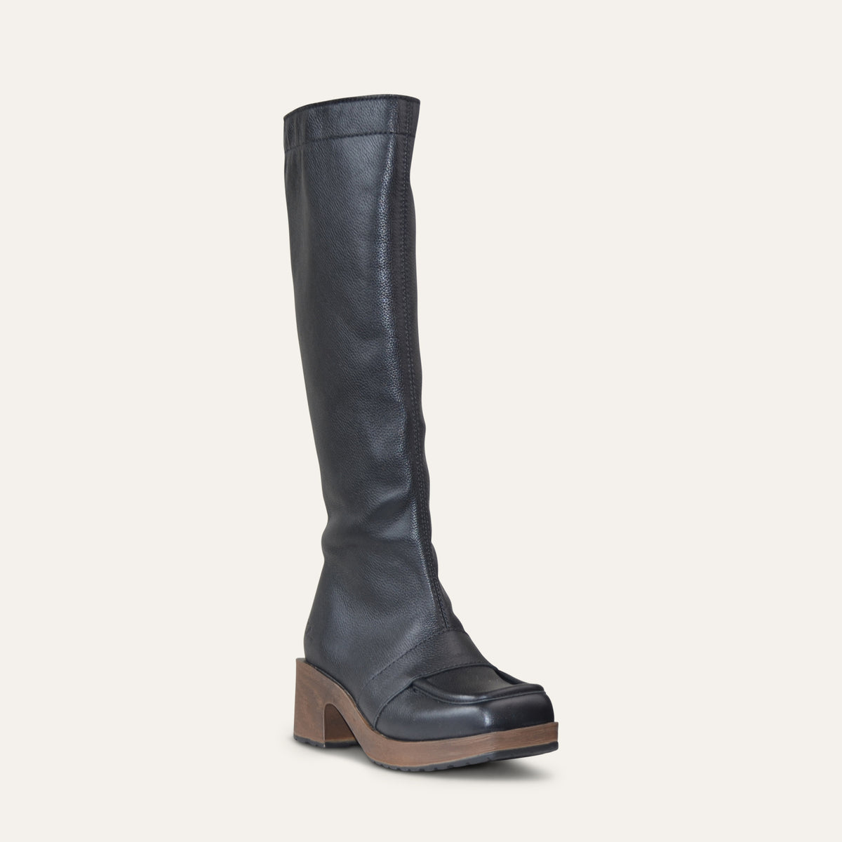A single knee-high black leather boot with a chunky brown block heel and a square toe, shown from a side profile on a light cream background.