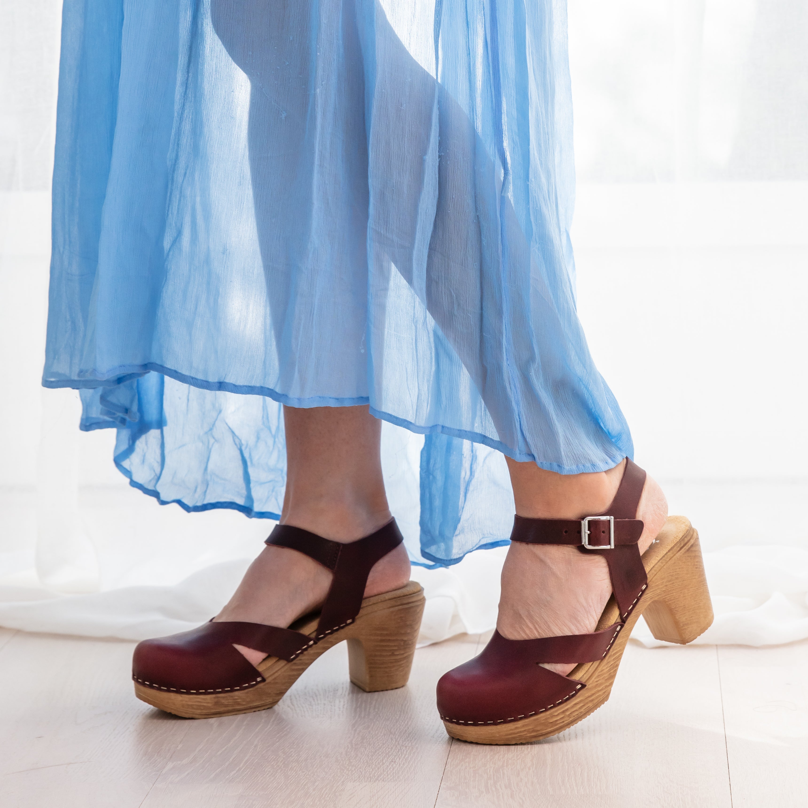 Penny plum leather clogs on model calou stockholm