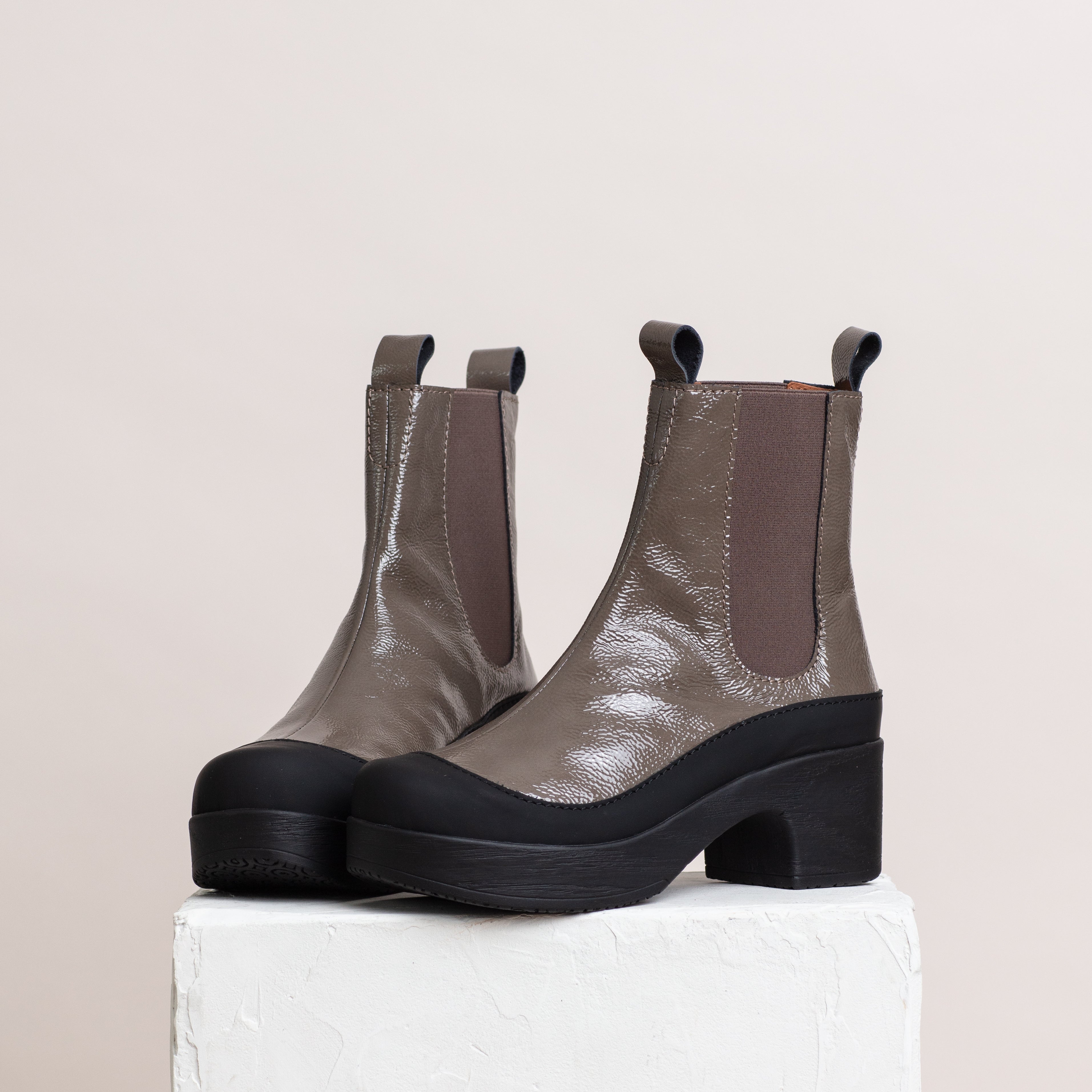 Susie mud patent leather boots on pillar, Calou Stockholm